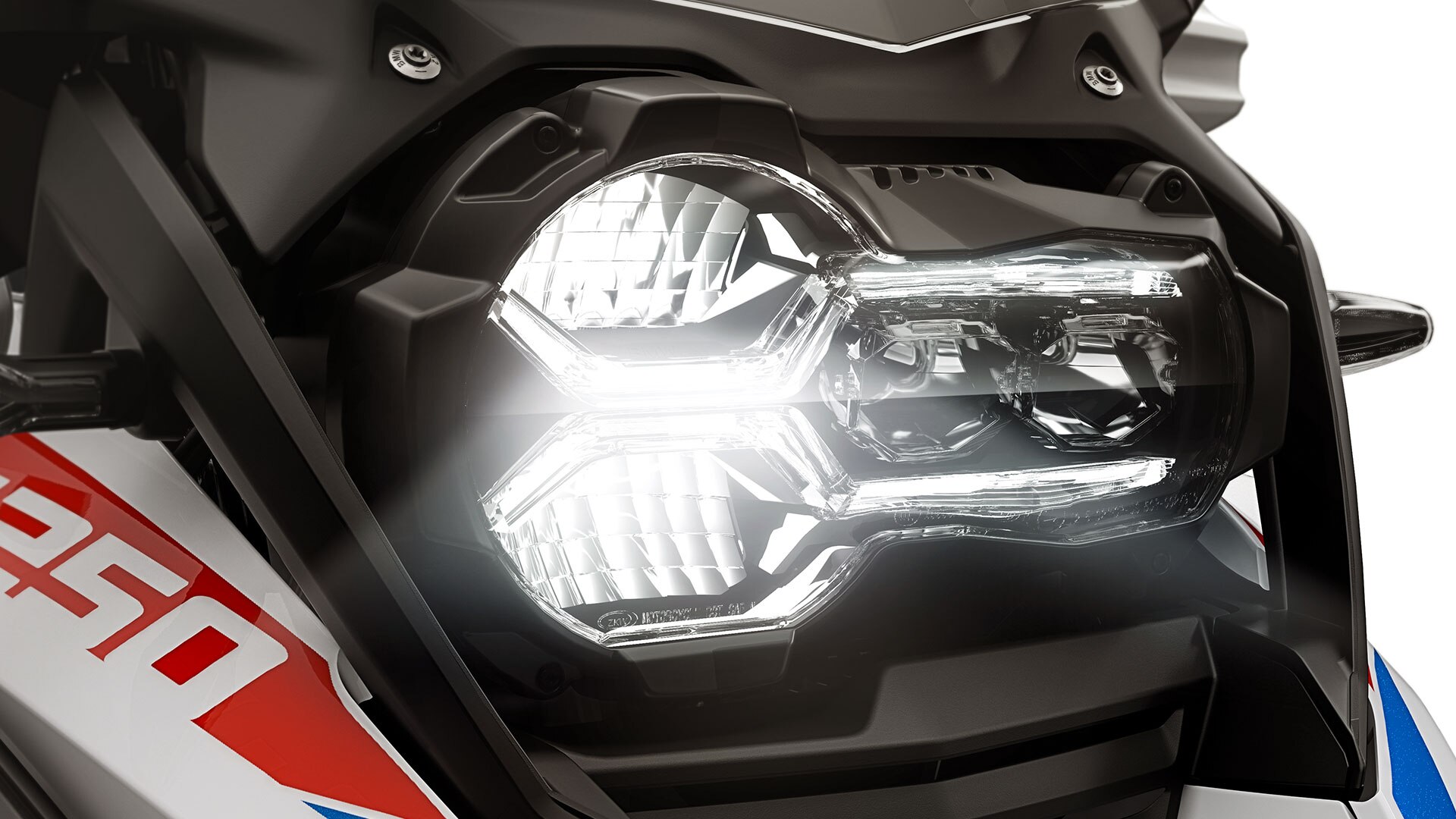 We see the front headlight of the R 1250 GS Adventure.