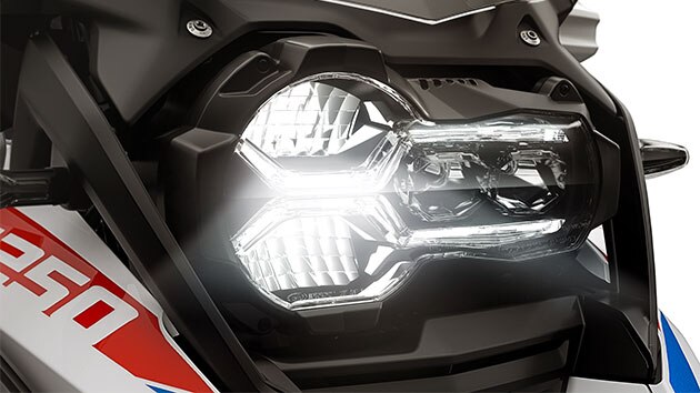 We see the front headlight of the R 1250 GS Adventure.