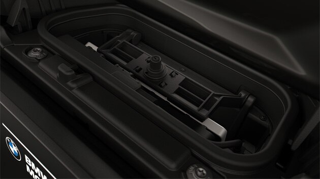 Integrated charging compartment with mobile phone.