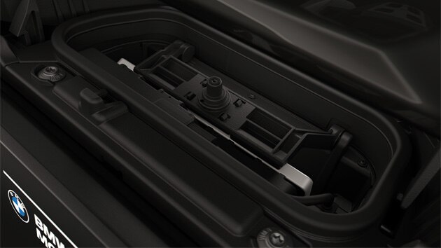 Integrated charging compartment with mobile phone.