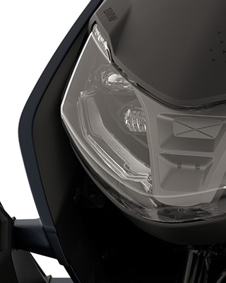 Front of the BMW CE 04 focussing on the LED headlights.